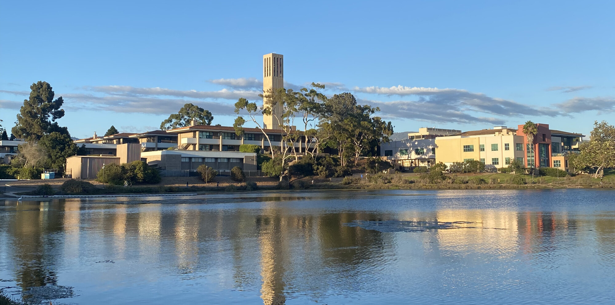 Storke Tower and the campus lagoon at UC Santa Barbara at golden hour